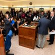 Photograph of a large crowd of people gathered in the Madera City Hall Council Chambers
